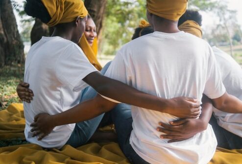 close-up-women-holding-each-other_23-2148959241